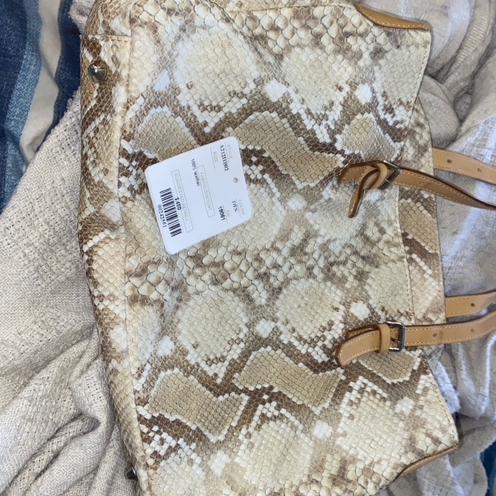 Doncaster genuine leather snake skin purse.